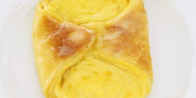 Stockbyte/Stockbyte/Getty Images Greek yogurt makes baked custard grainy and sour.
