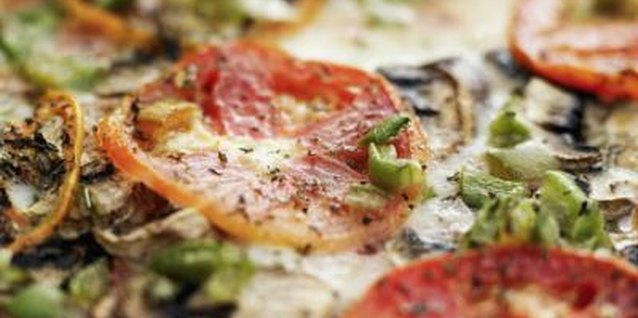 Stockbyte/Stockbyte/Getty Images Pairing cocktails with pizza makes for a rich, intense combination.