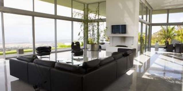Goodshoot/Goodshoot/Getty Images Dark leather furniture often apears more masculine.