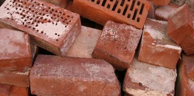 Jupiterimages/Photos.com/Getty Images Creatively decorate old bricks before using them as decor in or around your home.