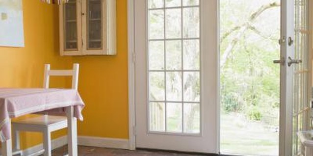 Thinkstock Images/Comstock/Getty Images Double doors are heavy, which may cause them to sag.