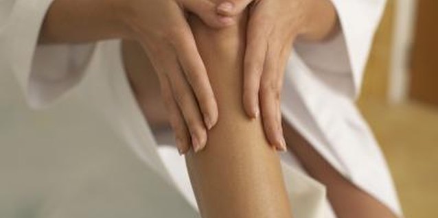 Jupiterimages/Creatas/Getty Images Uneven color from a spray tan can be blended in easily.