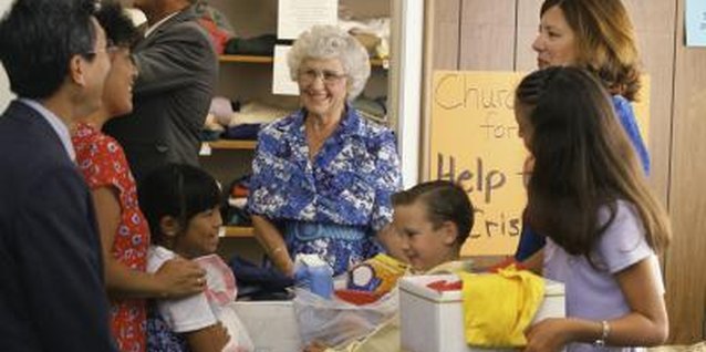 Brand X Pictures/Brand X Pictures/Getty Images Preschoolers will proudly help their parents collect and deliver items to local food banks and clothing drives.