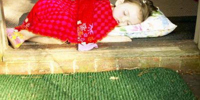 Jupiterimages/Photos.com/Getty Images After 1 year, your toddler can turn herself to avoid having her airway blocked by a pillow.