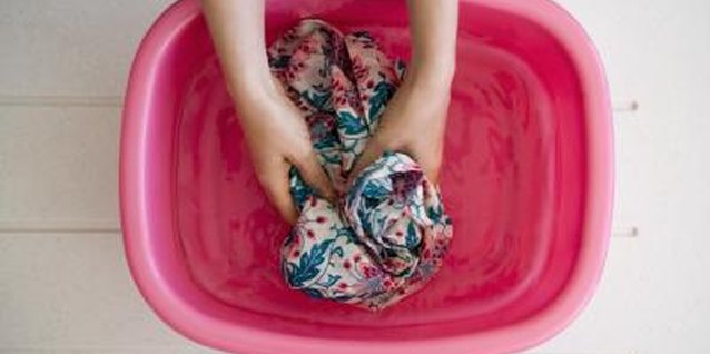 Jupiterimages/Polka Dot/Getty Images Hand wash wool pants in cool water.