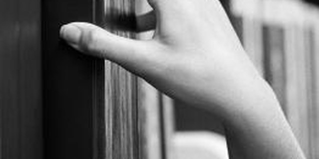 Stockbyte/Stockbyte/Getty Images Secure bookshelves to walls in a few simple steps.