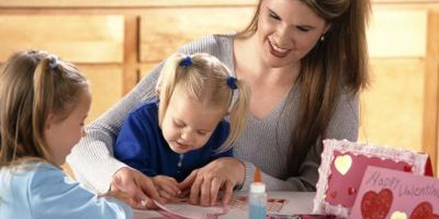 Brand X Pictures/Brand X Pictures/Getty Images Doing Valentine's Day activities with your tots is a great way to bond, even if most of the glue ends up on the table.