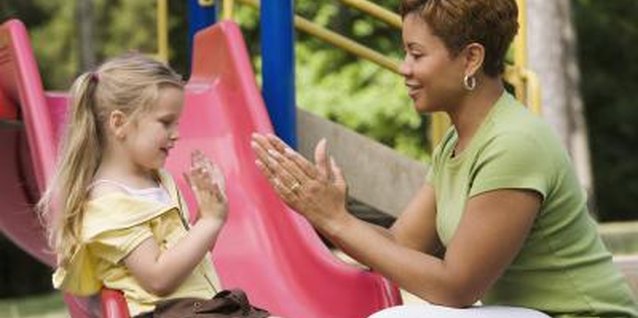 Jupiterimages/Comstock/Getty Images Your nanny will be a primary influence in your child's life.