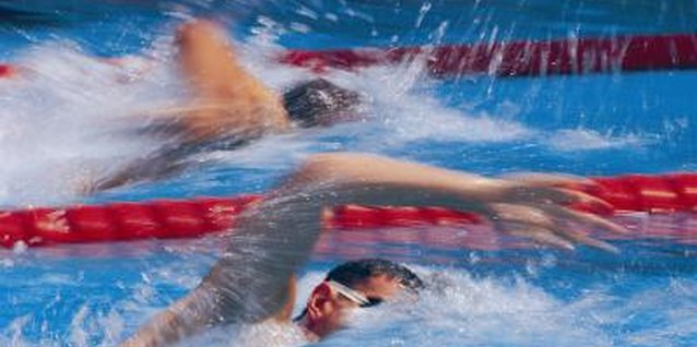 Stockbyte/Stockbyte/Getty Images Sprinting helps you train for distance swimming.