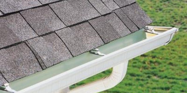 Comstock/Comstock/Getty Images Shingles can be applied directly over rolled roofing.