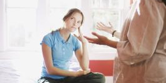 Jupiterimages/Brand X Pictures/Getty Images Be patient and firm as you integrate into a new family.