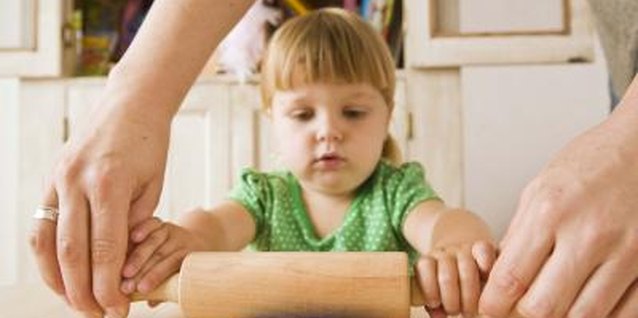 Jupiterimages/Polka Dot/Getty Images Encourage fine motor skill development with fun activities.