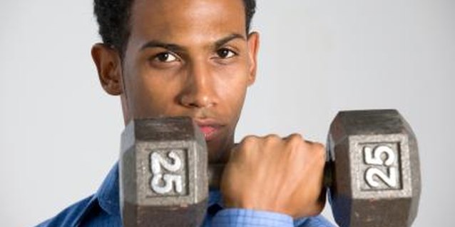 Photos.com/Photos.com/Getty Images A proper dumbbell curl should emphasize form, rather than lifting the most weight.