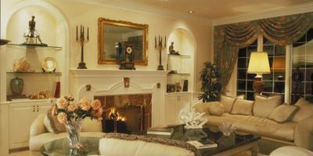 Ablestock.com/AbleStock.com/Getty Images Built-in wall shelves in a formal living room showcase a collection of fine art.