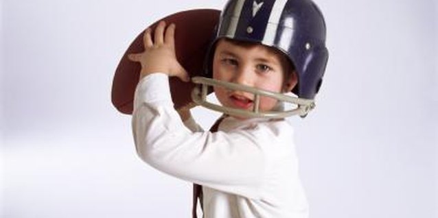 Creatas/Creatas/Getty Images You can make helmet-shaped goodie bags at the party, too.