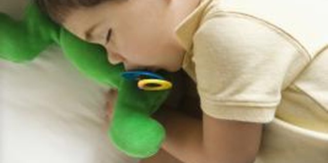 Creatas Images/Creatas/Getty Images Pacifiers that have soft holders are safer if your toddler falls with it in his mouth.