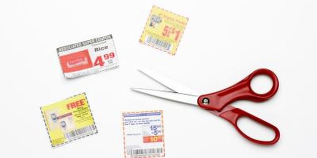 Creatas/Creatas/Getty Images Clipping coupons can help you save money.