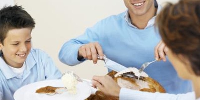 Stockbyte/Stockbyte/Getty Images Healthy eating habits are learned during family meal times.