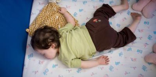 Jupiterimages/Photos.com/Getty Images When it's time to rouse a sleeping toddler, make a gentle wake-up call.
