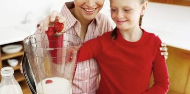 George Doyle/Stockbyte/Getty Images Schedule time alone with biological children to re-inforce your relationship.