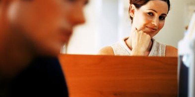 Stockbyte/Stockbyte/Getty Images Avoid drawing attention to your office romance by maintaining professional distance.
