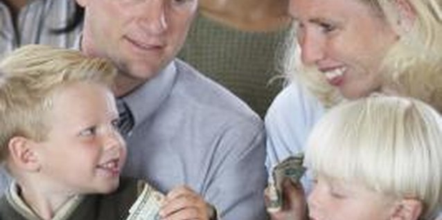 Brand X Pictures/Brand X Pictures/Getty Images Help your child understand the purpose of tithing to the local church.