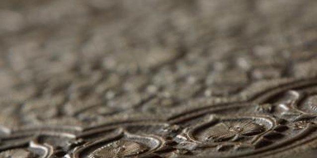 Photos.com/Photos.com/Getty Images Anaglypta wallpaper offers Victorian-era designs on vinyl for easy clean-up.