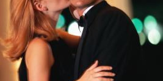 Stockbyte/Stockbyte/Getty Images Suspicious behavior and lack of intimacy may be signs that he's talking to a girlfriend.