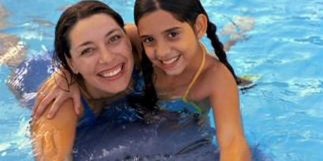 Creatas/Creatas/Getty Images A sand filter keeps your pool water sparkling and inviting.