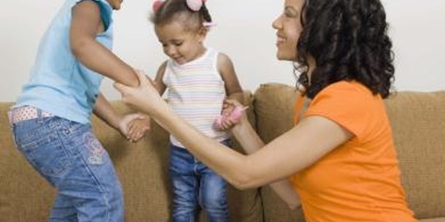 Jupiterimages/Creatas/Getty Images It's a mom's job to treat all of her children equally, even if some aren't biologically related to her.