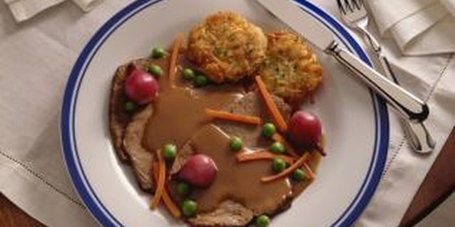 Jupiterimages/Comstock/Getty Images Pot roast can be seasoned with a variety of spices and herbs.