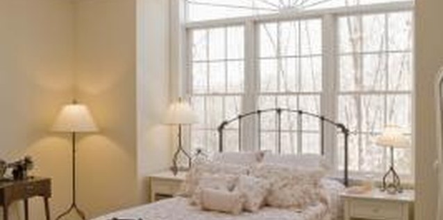 Jupiterimages/Creatas/Getty Images A bed skirt provides a neat finish and hides the mattress frame.