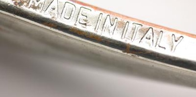 Jupiterimages/Photos.com/Getty Images You should use a polishing cloth to clean engraved areas.