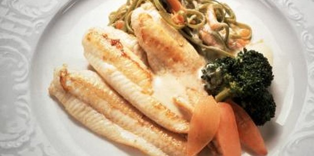 Eising/Photodisc/Getty Images Tilapia is low in fat and high in protein.