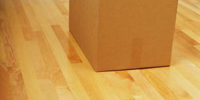 Brand X Pictures/Brand X Pictures/Getty Images Make a cardboard box planter for a salad or herb garden.