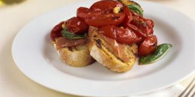 Creatas Images/Creatas/Getty Images Pan fry or grill additional fruit to top the pork chops.