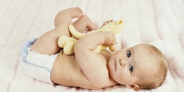 Digital Vision./Digital Vision/Getty Images A few telltale signs indicate when your baby needs a larger size.