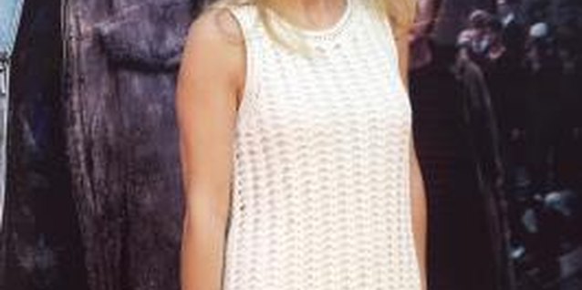 Carlos Alvarez/Getty Images Entertainment/Getty Images Model and humanitarian Genoveva Casanov wears a white crochet dress on the red carpet.