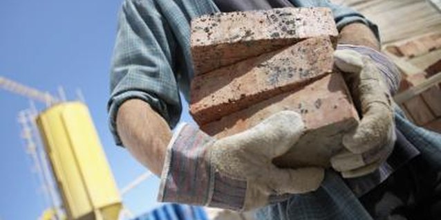 Digital Vision./Photodisc/Getty Images Leftover or salvaged bricks serve many useful functions around the garden.