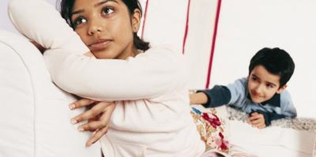 Digital Vision./Digital Vision/Getty Images A girl ignores her brother's attempts to annoy her.