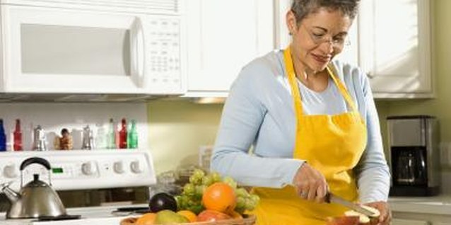 Creatas Images/Creatas/Getty Images Acidity helps keep your cut apples fresh-looking.