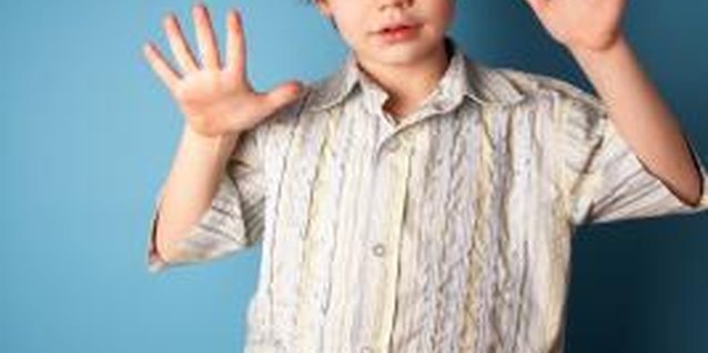 Jupiterimages/Photos.com/Getty Images Provide activities that stimulate your child to help him learn body awarness.