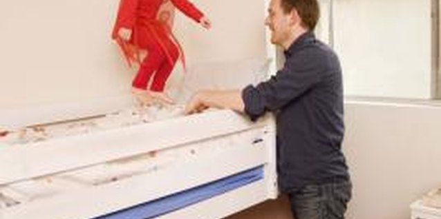 Jupiterimages/Brand X Pictures/Getty Images Matching loft beds leave room underneath for play and storage.