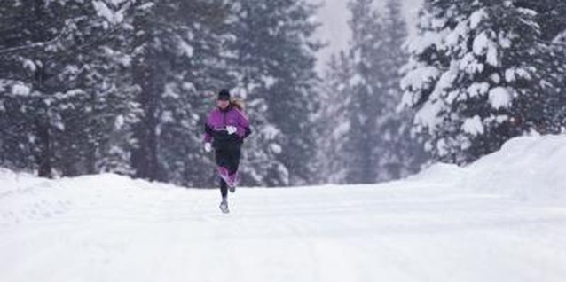 Stockbyte/Stockbyte/Getty Images Take precautions when jogging outside in the winter cold.
