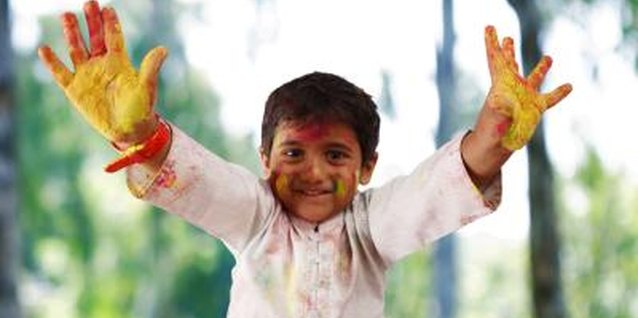Visage/Stockbyte/Getty Images Your kids might like to help you paint your yard decorations.