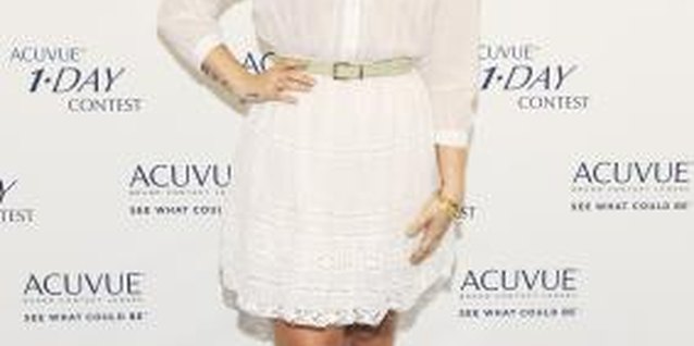 Rich Polk/Getty Images Entertainment/Getty Images Demi Lovato pairs her brown boots with a white dress for contrast.