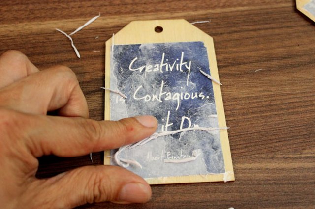 Rub wet paper with your fingers