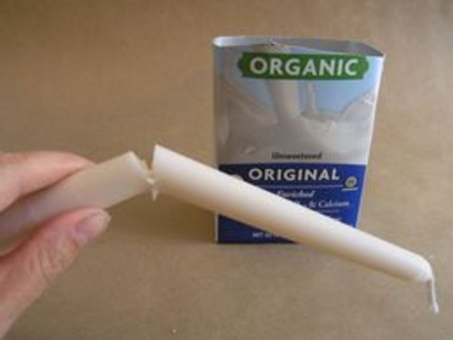 Break candle so that it is a little shorter than the milk carton.