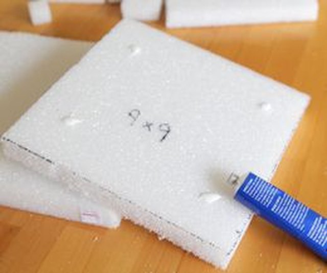 Use styrofoam glue to stack your squares into a pyramid.