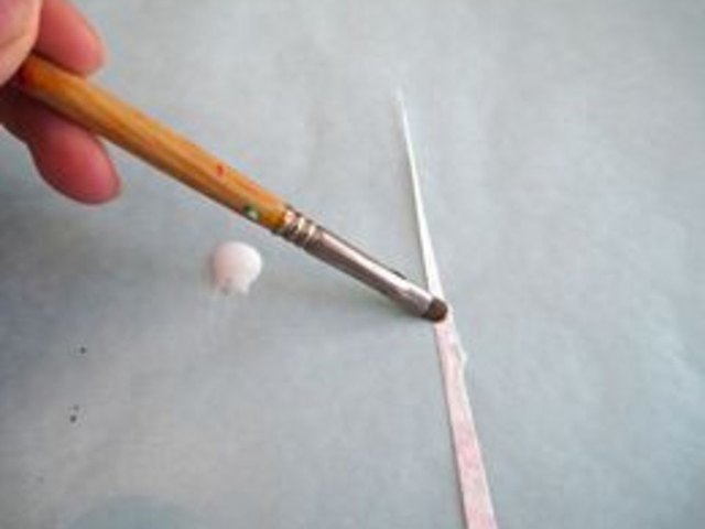 Glue tip of triangle.